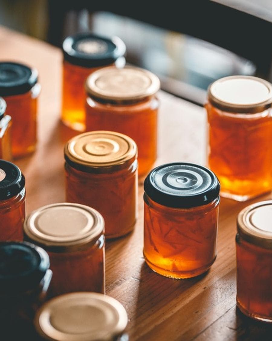 Jars of small-batch preserves on a workbench