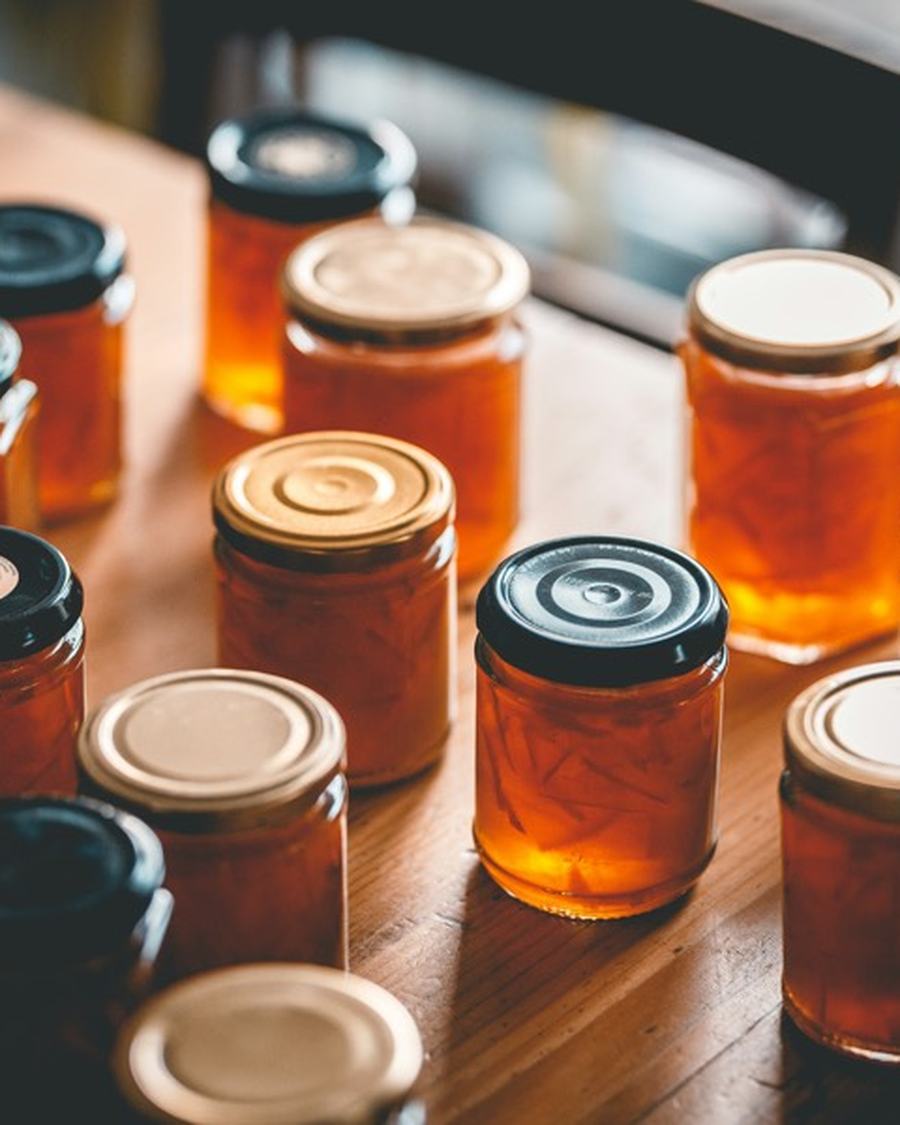 Jars of small-batch preserves on a workbench